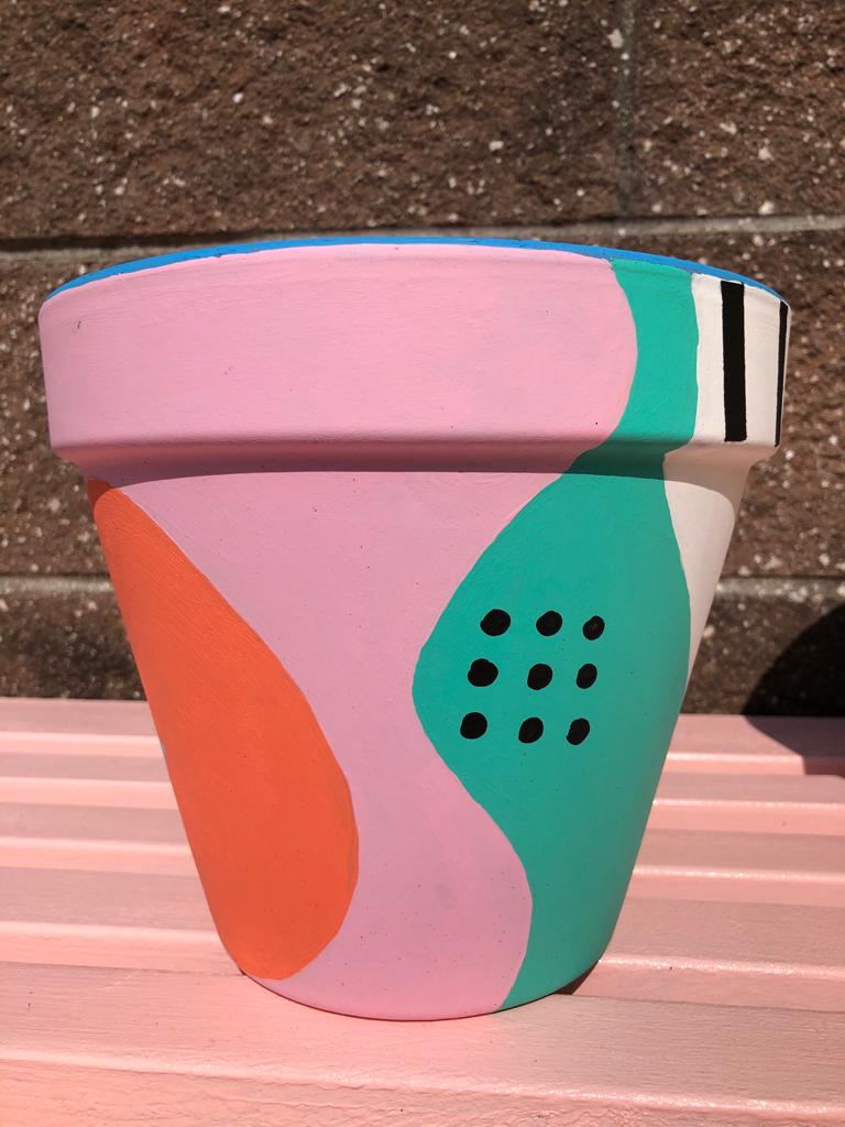 A close-up of a MEDIUM sized Happy Pot - VIBES, byFrolly
